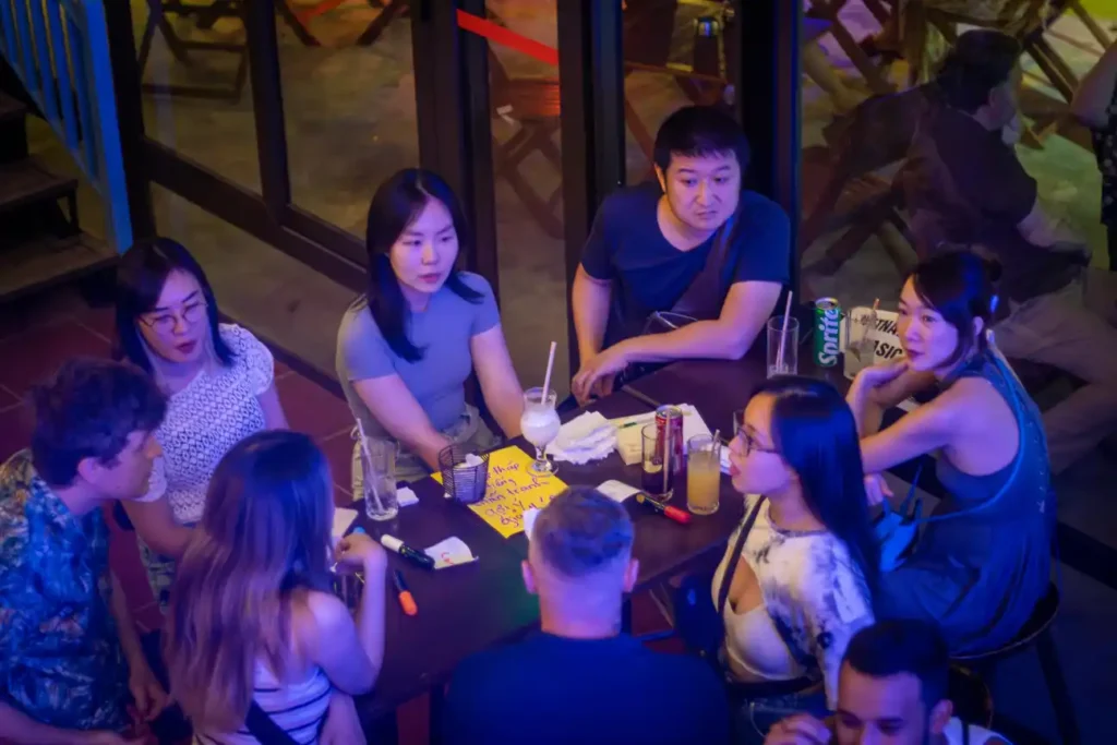 7 Amazing Benefits of taking Vietnamese lessons in Hanoi People chatting at Vietnamese language exchange event